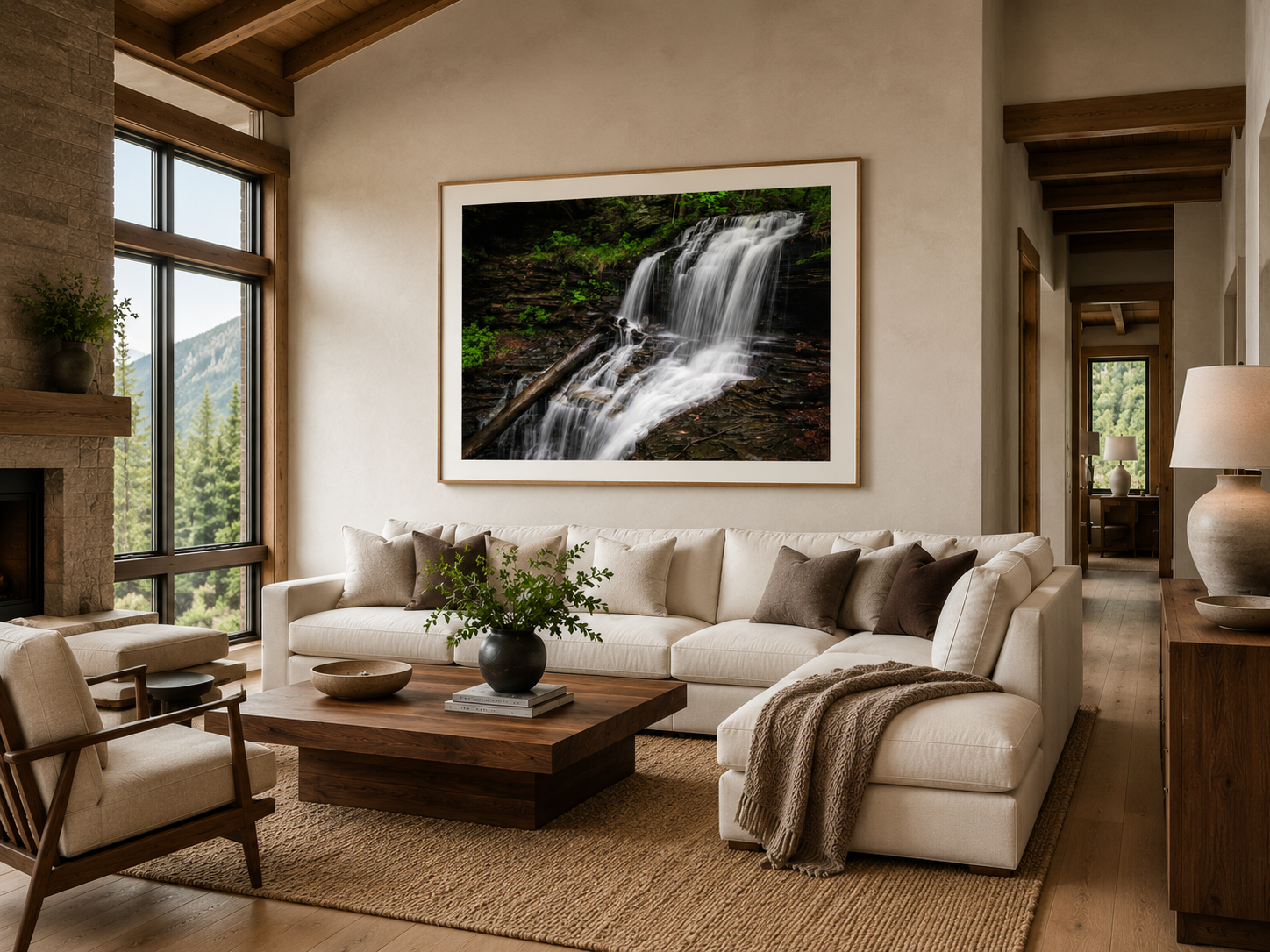 Large waterfall long exposure wall art above a couch in a modern living room